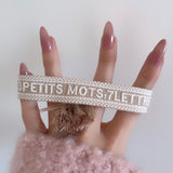 Bracelet brodé « 3 petits mots, 7 lettres »